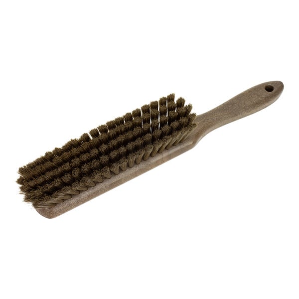 A close-up of a Carlisle Sparta brown counter brush with soft polyester bristles.