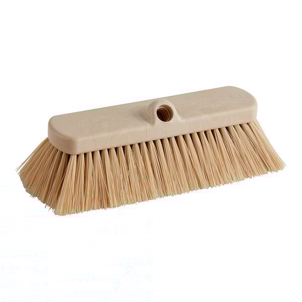 A Carlisle Sparta tan vehicle and wall cleaning brush with a long handle.