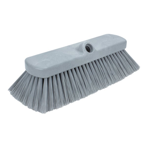 A grey Carlisle Sparta Flo-Thru brush with a white handle.