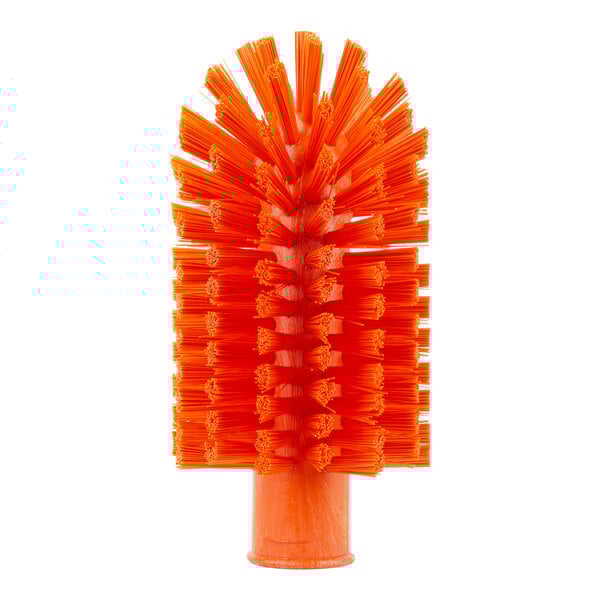 A close-up of the Carlisle Sparta orange pipe and valve brush with bristles.