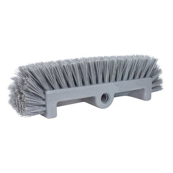 A close-up of a Carlisle Sparta grey floor scrub brush with end bristles.