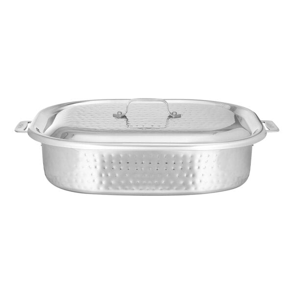 A silver stainless steel Bon Chef French oven with a lid.