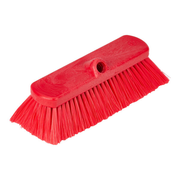 A red Carlisle Sparta deck brush with a long handle.