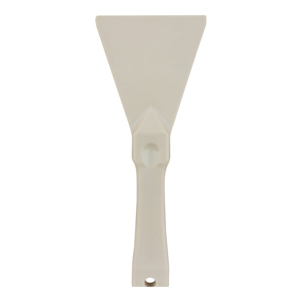 A tan plastic handheld scraper with a hole in the end.