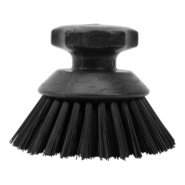 A Carlisle Sparta black round palm scrub brush with bristles.