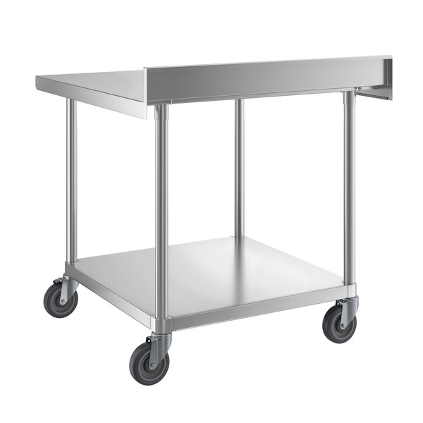 A stainless steel work table with a backsplash, undershelf, and four caster wheels.