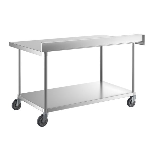 A stainless steel work table with a lower shelf, four legs, casters for mobility, and a raised backsplash along one edge.