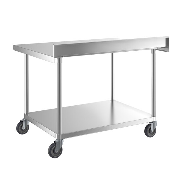 A silver metal table with wheels.