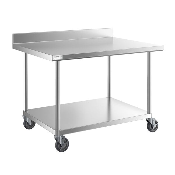 A stainless steel work table with a backsplash, undershelf, and four caster wheels.
