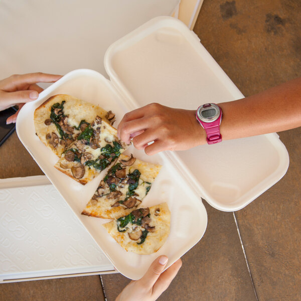 A rectangular compostable sugarcane tray containing three slices of vegetable pizza.