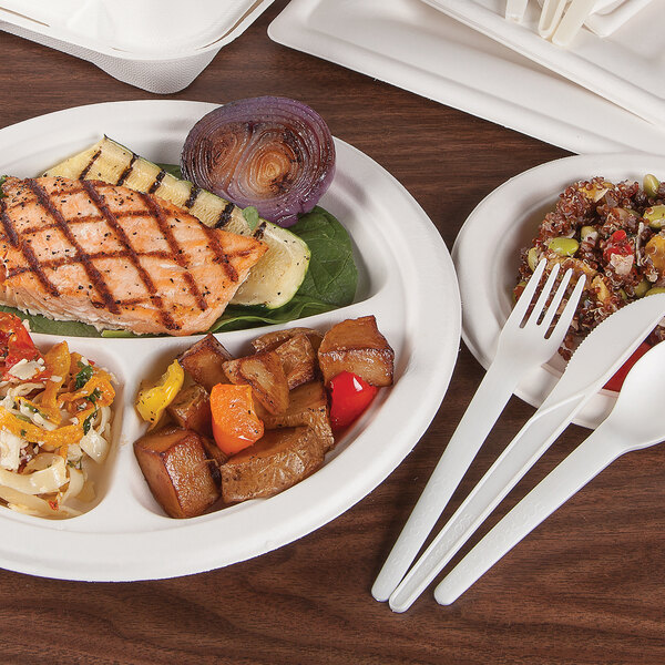 A white, round, 10-inch, 3-compartment compostable plate made from sugarcane, shown with food served on it.