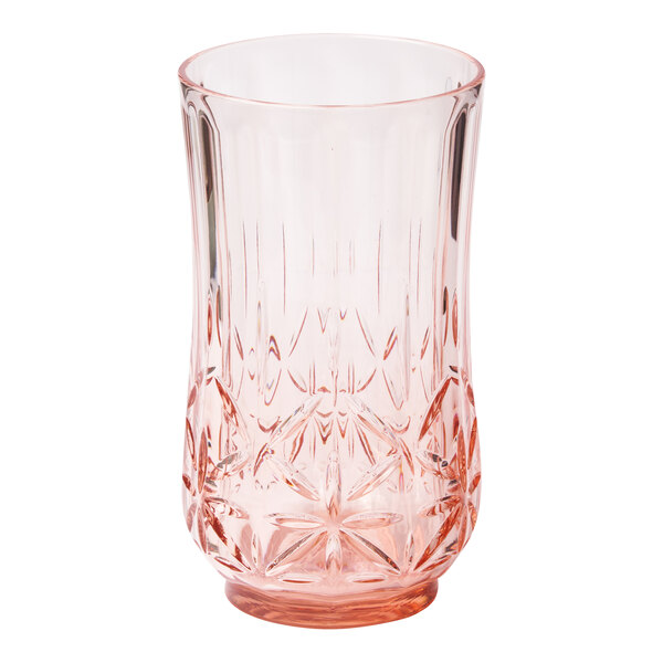 A Sophistiplate blush pink plastic tumbler with a cut out design.