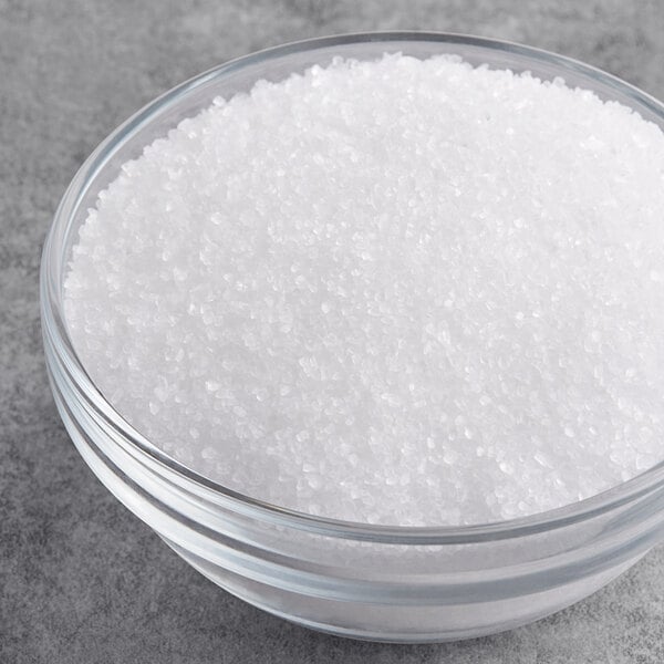 A bowl of Coarse Kosher Salt on a table.