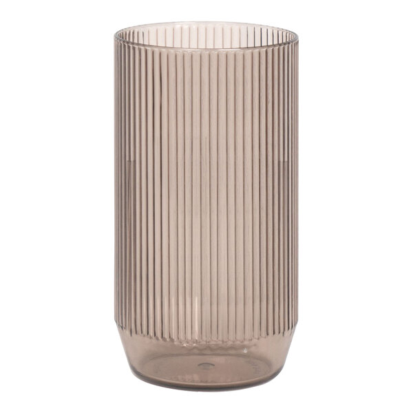 A smoke plastic rocks glass with a ribbed design on it.