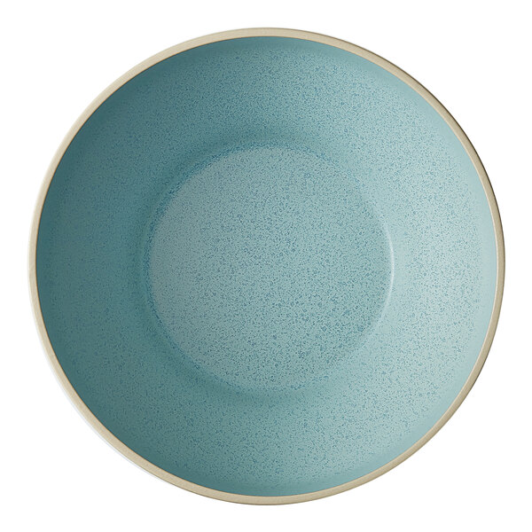 A frosted blue stoneware bowl with a white rim.