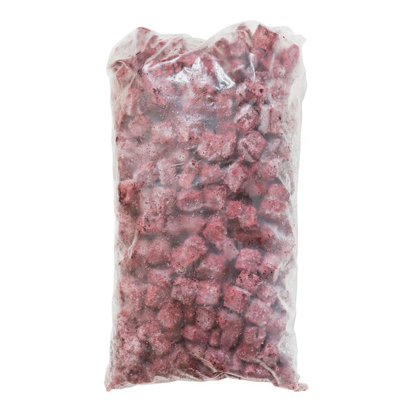 A plastic bag of red Pitaya Foods Acai berry cubes.