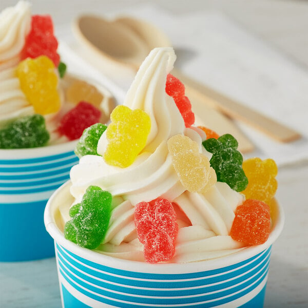 A cup of ice cream topped with Albanese Sour Gummi Bears.