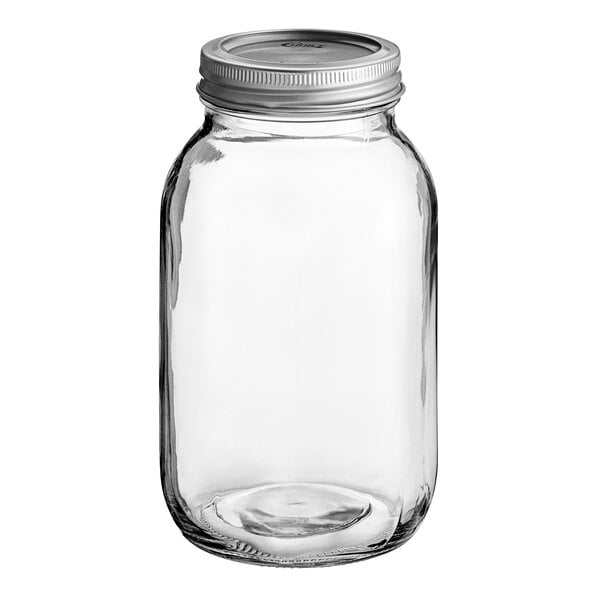 A clear glass quart jar with a silver metal lid.