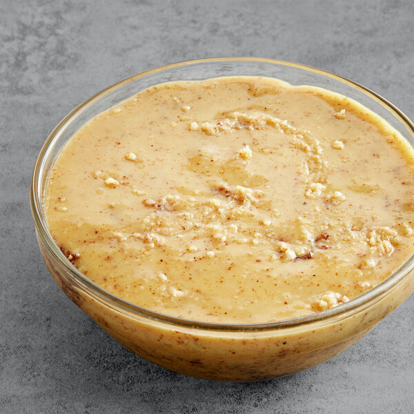 A bowl of walnut butter on a table.