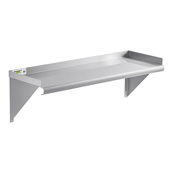 A Regency stainless steel wall shelf with rolled edges and a backsplash.