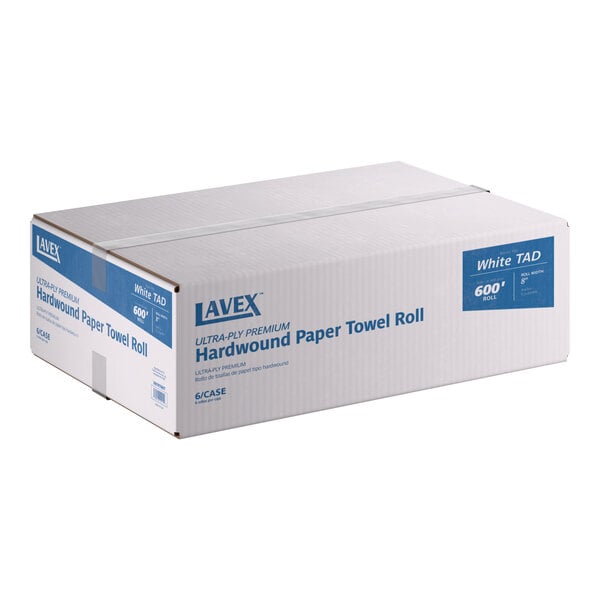 A case of Lavex Premium 8-inch white hardwound paper towel rolls, containing six 600-foot rolls.