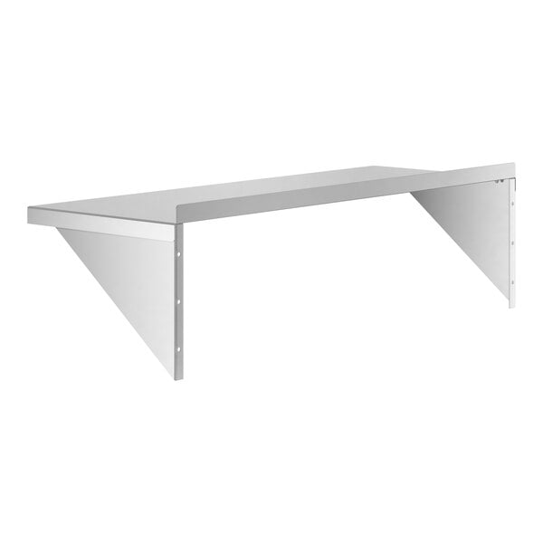 A white shelf with a metal Regency wall shelf on top.