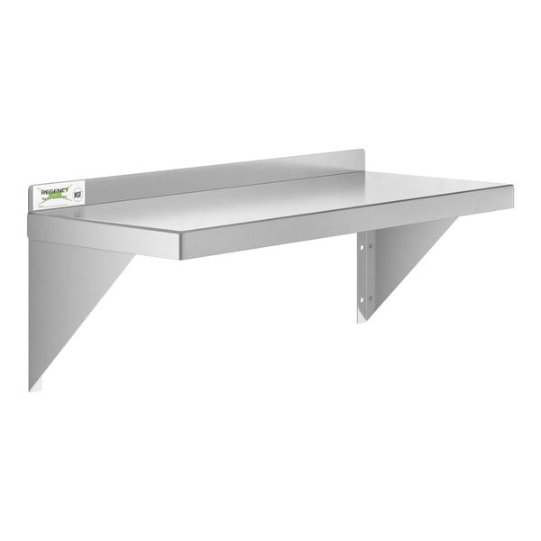A Regency stainless steel wall shelf with a white label.