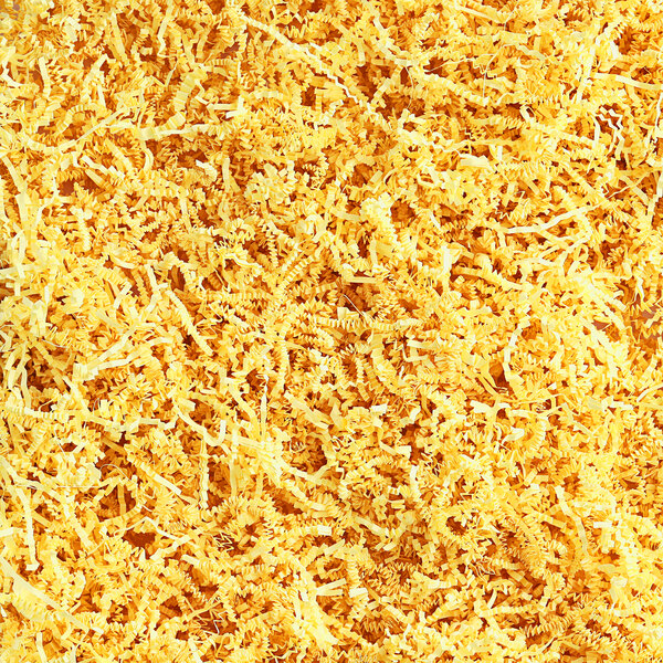 A pile of Spring-Fill Canary Crinkle Cut paper shred.