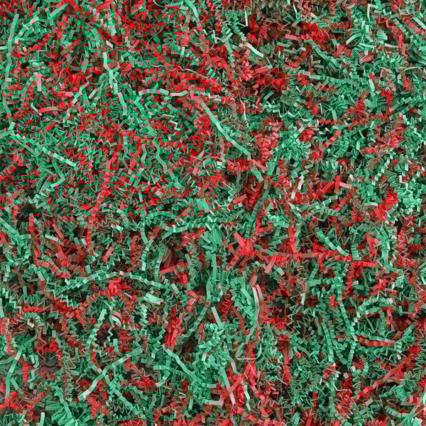 A pile of Spring-Fill red and green crinkle cut paper shred.