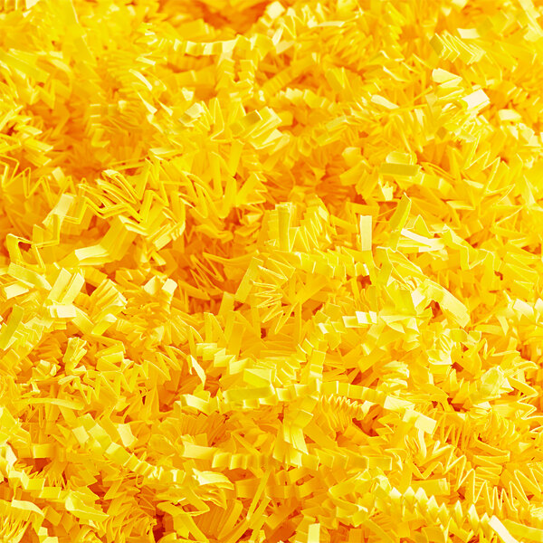 A pile of yellow Spring-Fill Crinkle Cut Paper Shred.