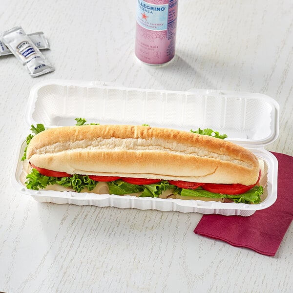 A hoagie in a white Ecopax take-out container.