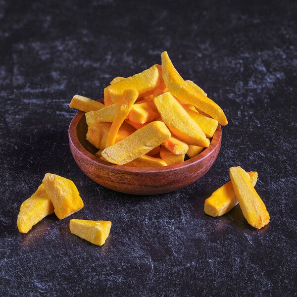 A close up of freeze-dried mango slices.