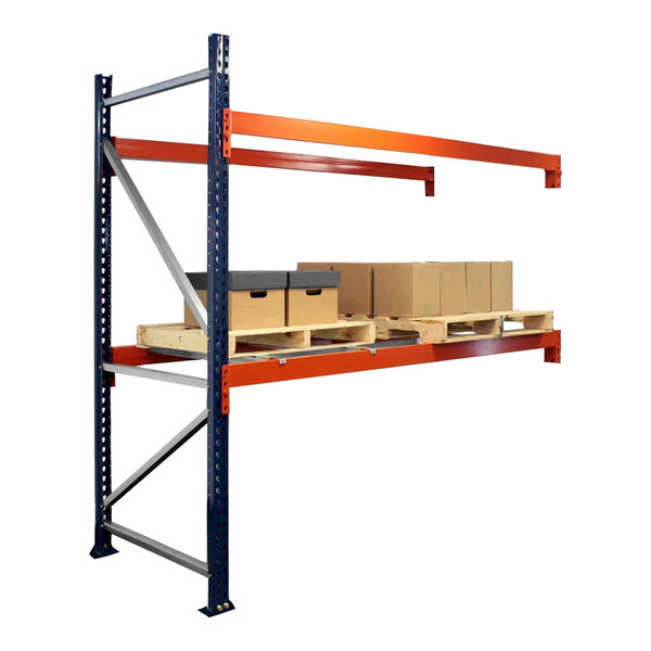 A blue and orange Interlake Mecalux heavy-duty bolted pallet rack with boxes on the shelves.