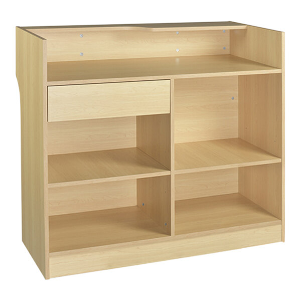 A Maple cash wrap counter with a ledge and drawers.