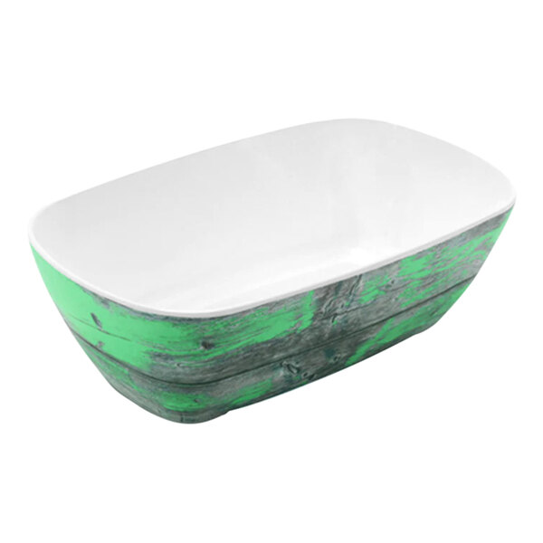 A white and green melamine crock with a green rim.