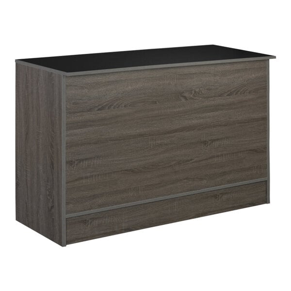 A dark gray wooden checkout service counter with a black top.