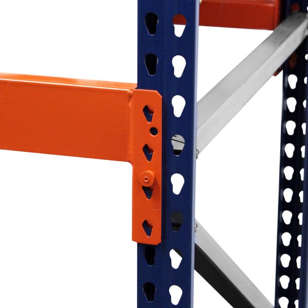 Interlake Mecalux heavy-duty bolted teardrop pallet rack with blue and orange metal shelves.