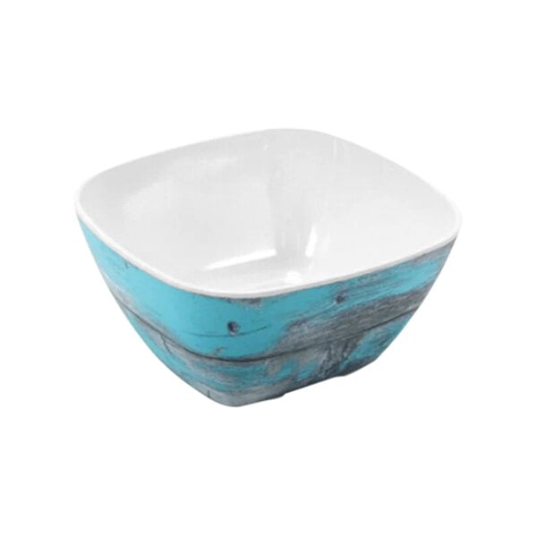 A white crock with a blue and white surface.