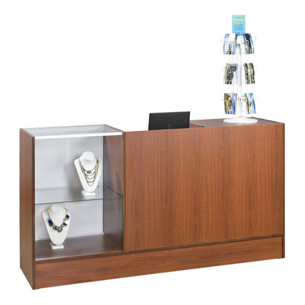 A 72" x 18" x 38" cherry service counter with a showcase full of jewelry.