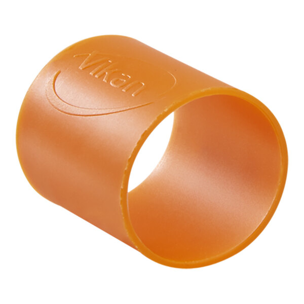 A close-up of a Vikan orange rubber band with the word "Vik" on it.