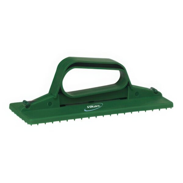 A green Vikan handheld scrub pad holder.