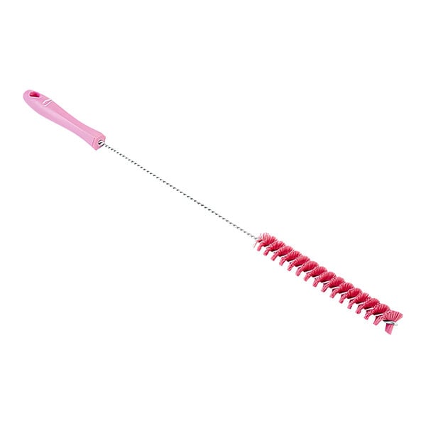 A pink tube brush with a white handle.