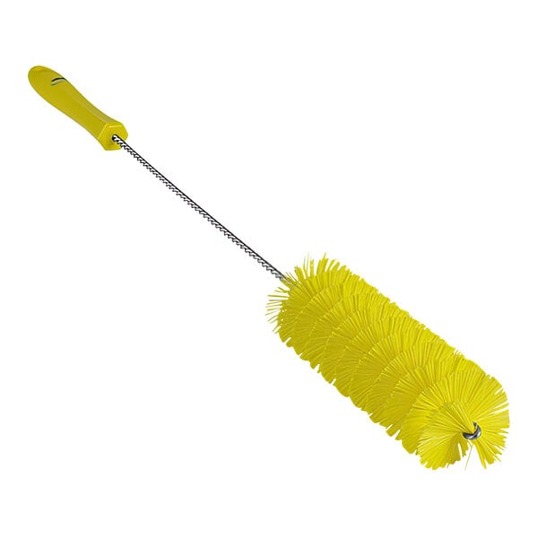 A close-up of a yellow Vikan tube brush with a black handle.