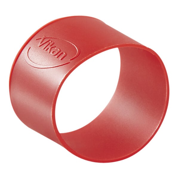 A red circular rubber band with the word Vikan on it.