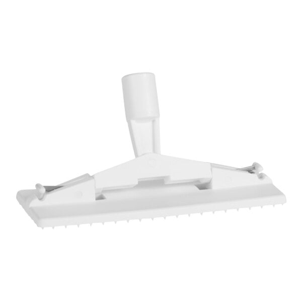 A white plastic Vikan scrub pad holder with a handle.
