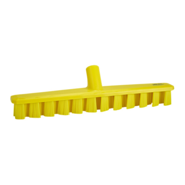 A close up of a Vikan yellow deck scrub brush head with stiff bristles.