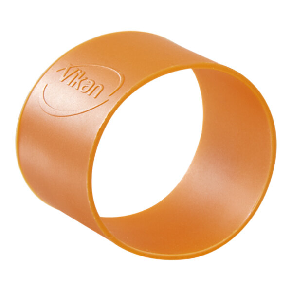 A close-up of an orange rubber band with the word "Vikan" on it.