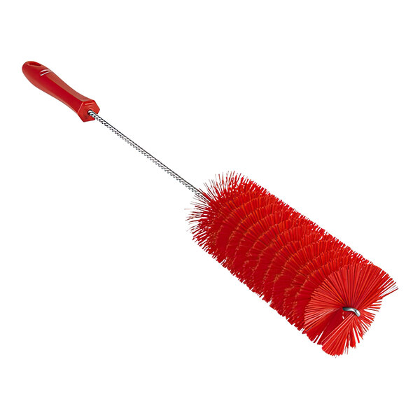 A red brush with a long handle.