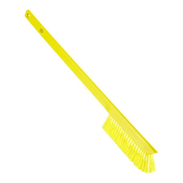 A Vikan yellow cleaning brush with a handle and medium bristles.