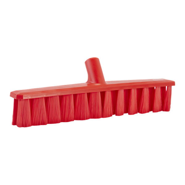 A red Vikan broom head with soft bristles.